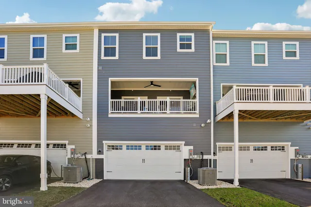 a front view of a building with a garden