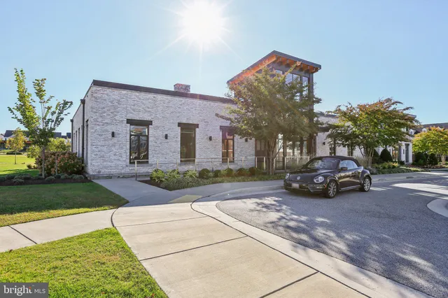 a living room with fireplace furniture and a large window