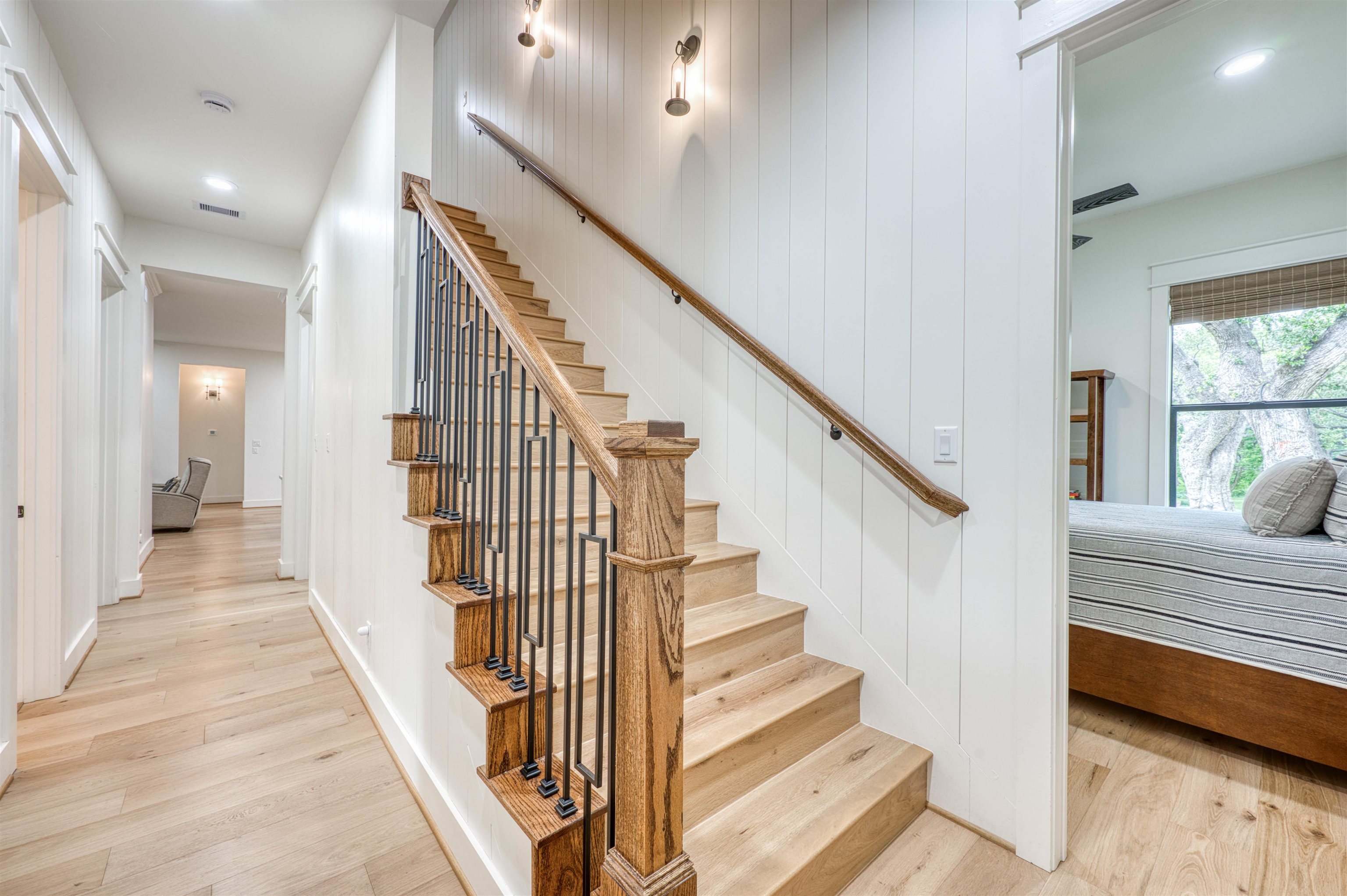 2001 Granite Cove Road Kingsland, TX 78639 - Photo 21 of 42 a view of staircase with lots of frames on wall and windows
