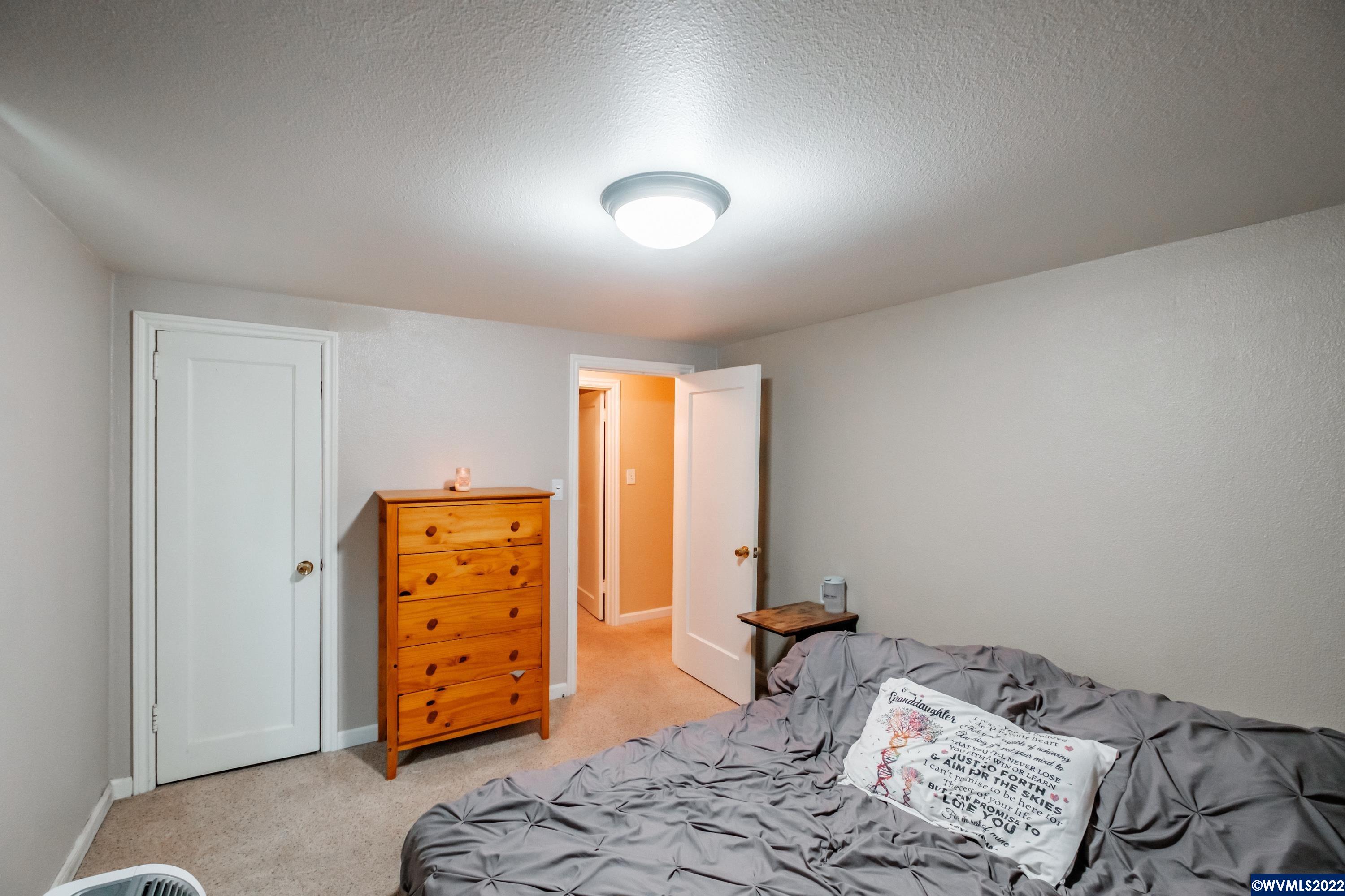 4725 Knox Butte Road East Albany, OR 97322 - Photo 25 of 41 a bedroom with a bed and a dresser