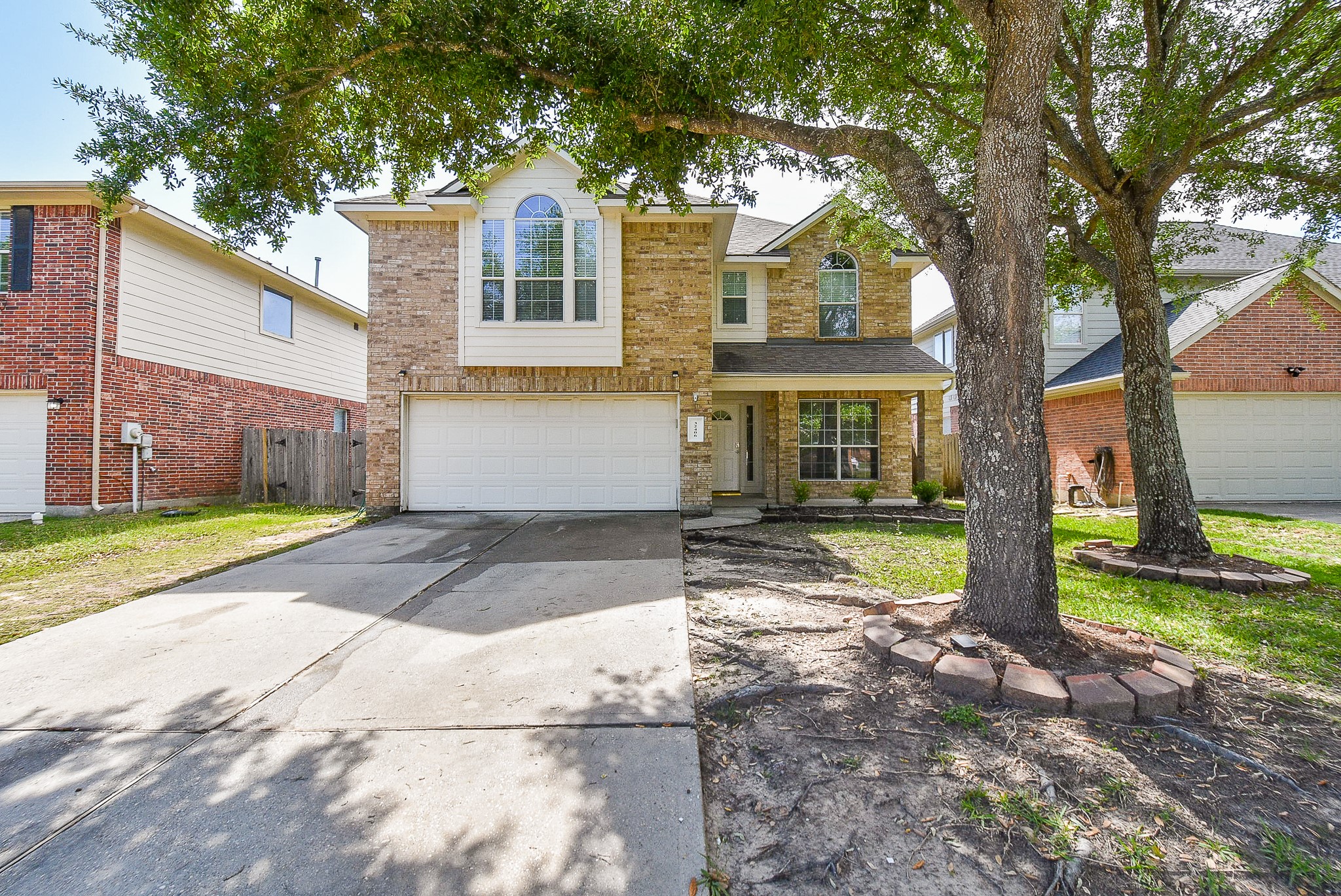 32406 Cross Spring Park Lane Conroe, TX 77385 - Photo 1 of 32 a front view of a house with a yard and garage