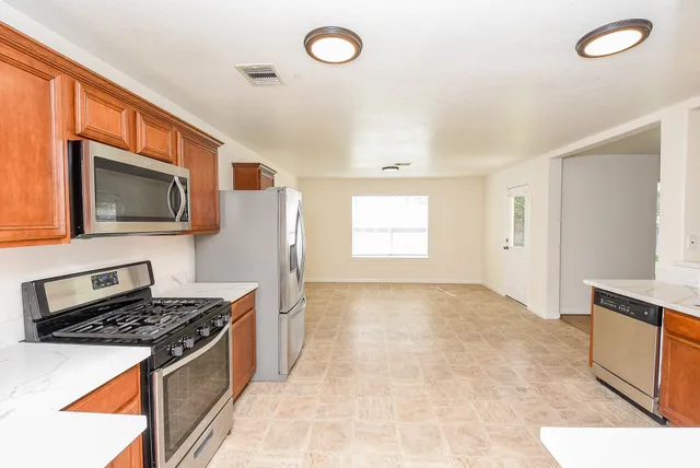 a kitchen with a stove and a microwave