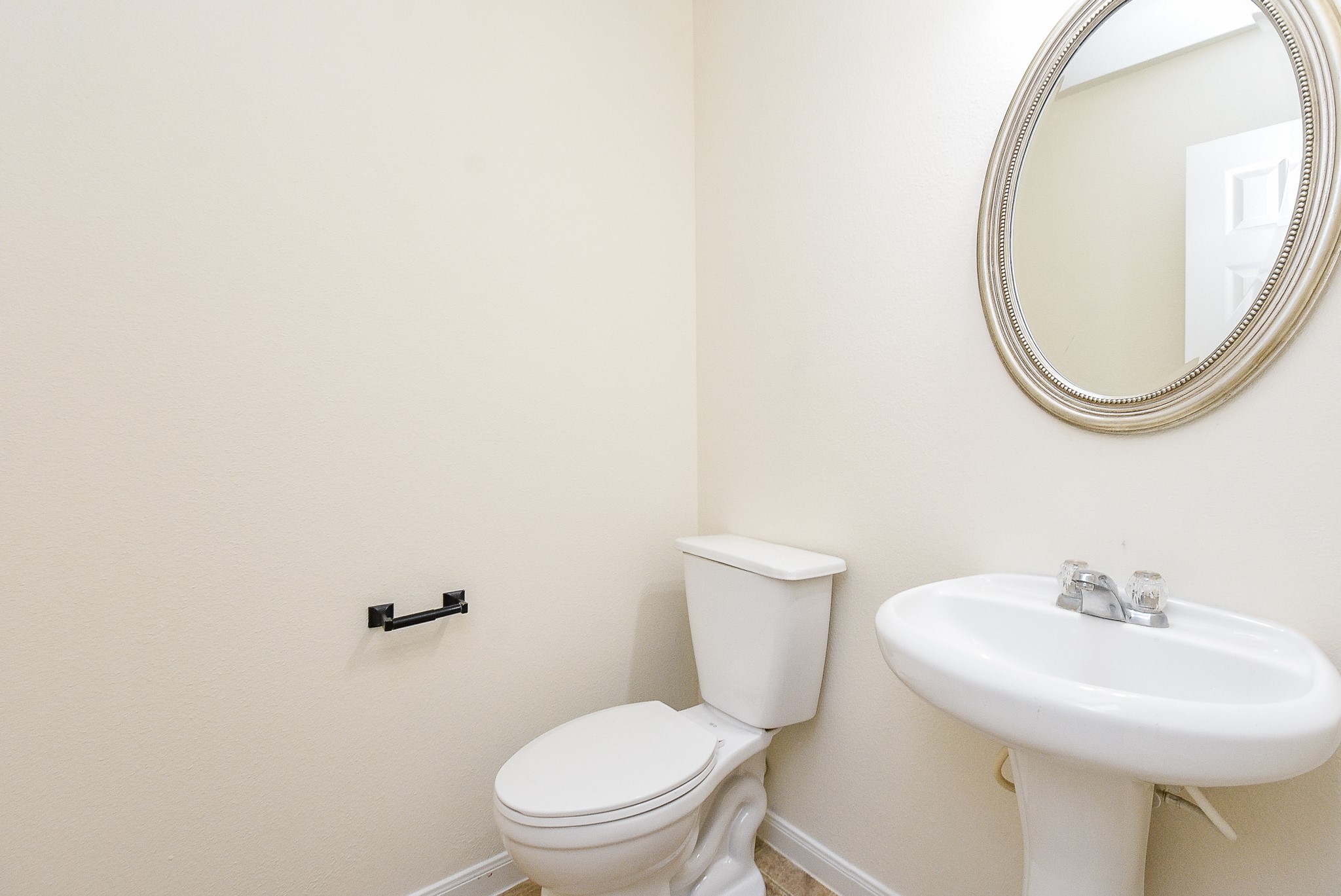 32406 Cross Spring Park Lane Conroe, TX 77385 - Photo 19 of 32 a white toilet sitting next to a bathroom sink