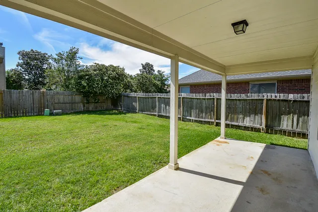 a view of a backyard with a small cabin