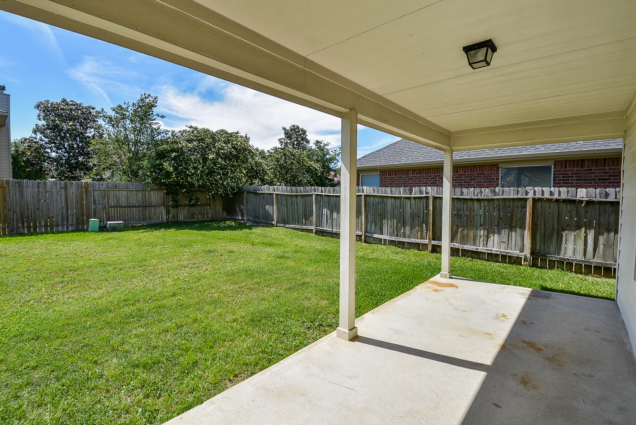 32406 Cross Spring Park Lane Conroe, TX 77385 - Photo 31 of 32 a view of a backyard with a small cabin