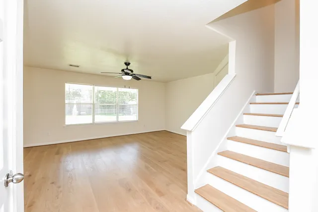 a view of an entryway with wooden floor