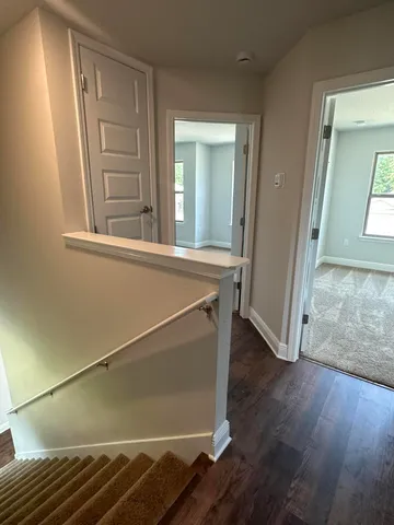 an entryway with wooden floor