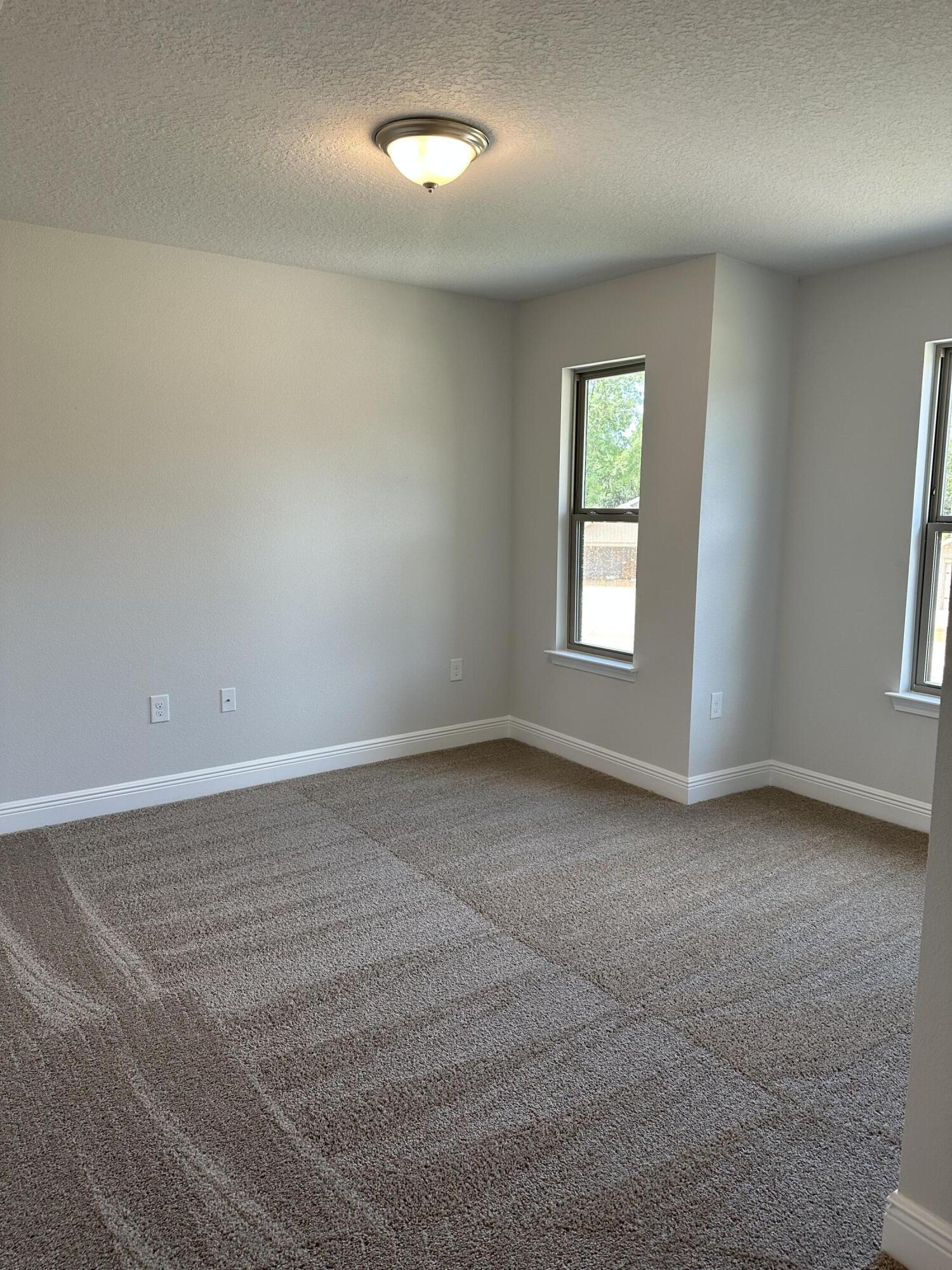 188 Ridgeway Circle Crestview, FL 32536 - Photo 18 of 22 an empty room with windows