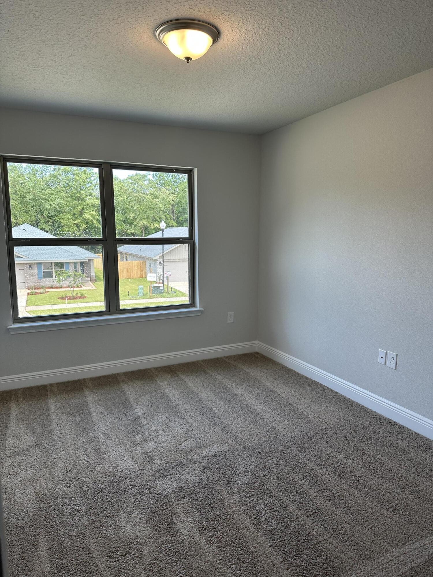 188 Ridgeway Circle Crestview, FL 32536 - Photo 20 of 22 an empty room with a window