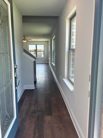 wooden floor in a empty room with windows