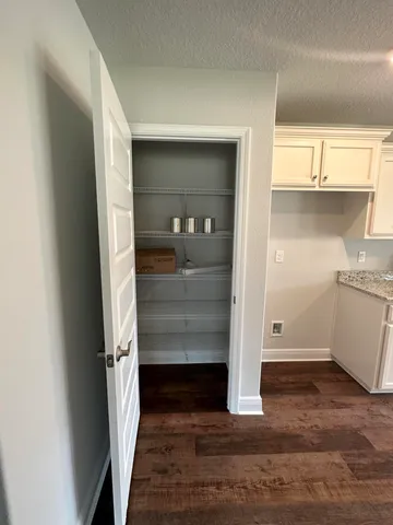 a view of walk in closet with window