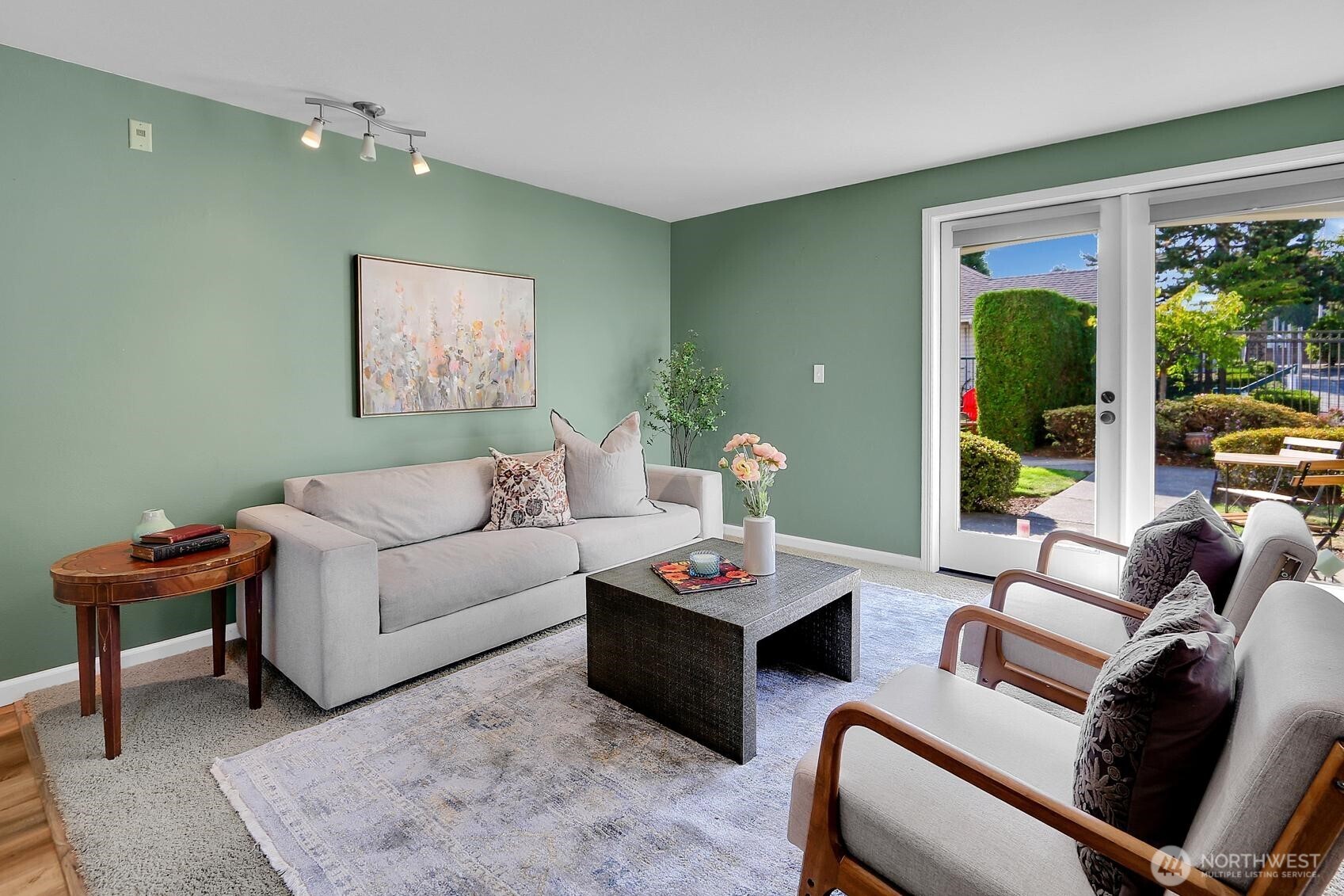 a living room with furniture and a mirror