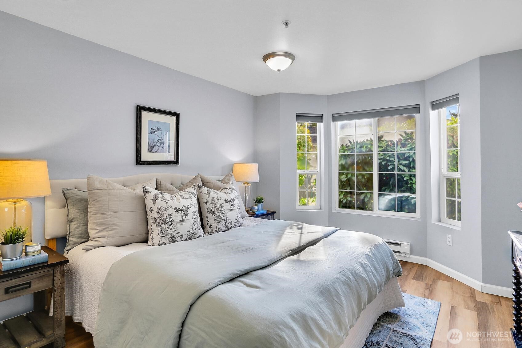 12505 4th Avenue West, Unit 1040 Everett, WA 98204 - Photo 13 of 20 a bedroom with a bed and a large window