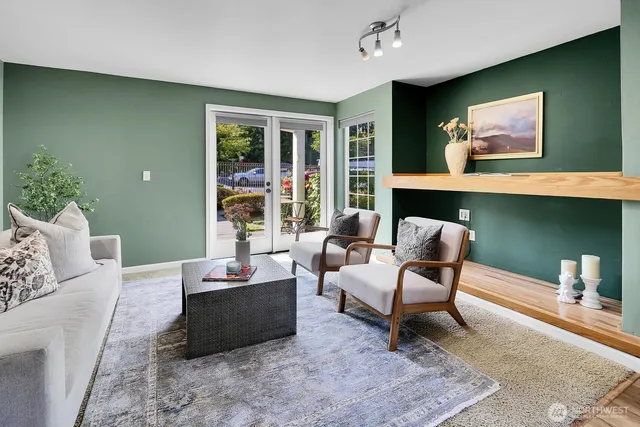 a living room with furniture and a large window