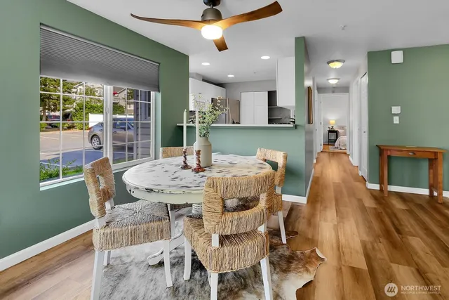 a view of a dining room with furniture and wooden floor