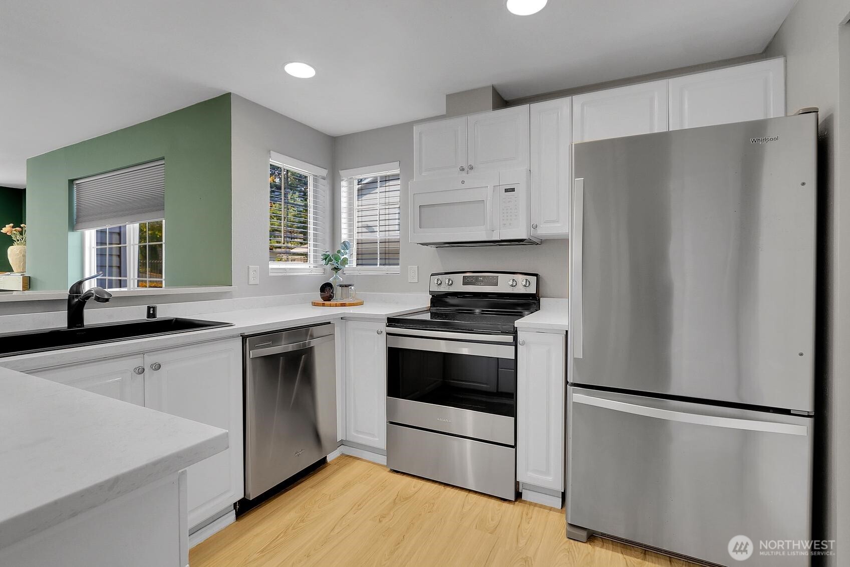 12505 4th Avenue West, Unit 1040 Everett, WA 98204 - Photo 8 of 20 a kitchen with a refrigerator sink and stove
