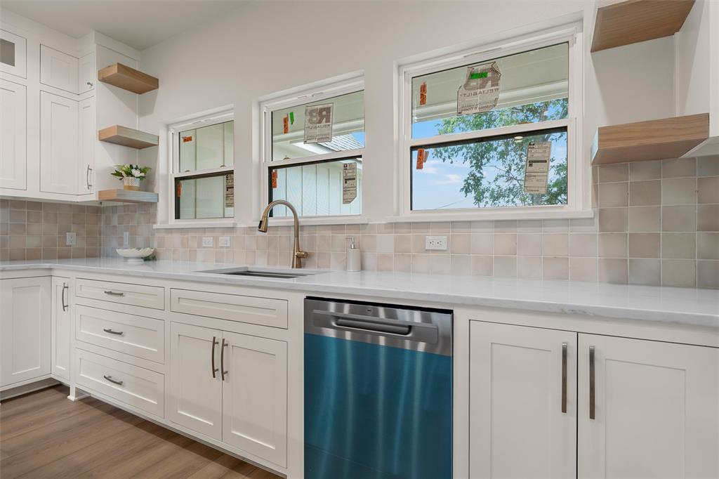5200 Bogey Lane Waco, TX 76708 - Photo 11 of 37 a kitchen with white cabinets and window