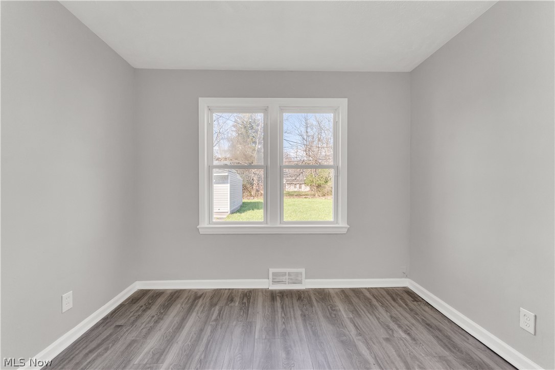 2521 Greenvale Road Cleveland, OH 44121 - Photo 16 of 23 Light gray walls with white trim and wood-finish flooring