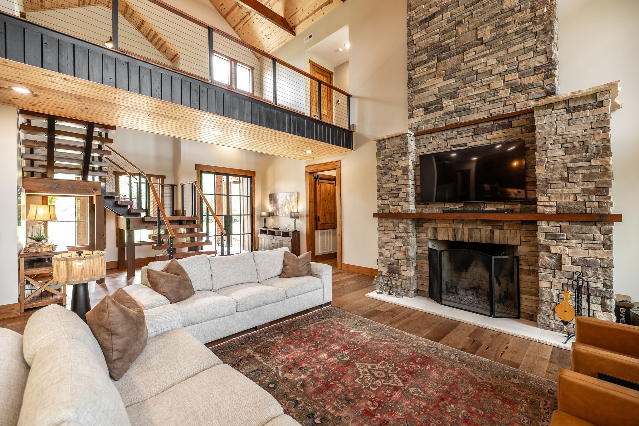 324 Lakeview Road Gallatin, TN 37066 - Photo 33 of 92 a living room with furniture a fireplace and a flat screen tv