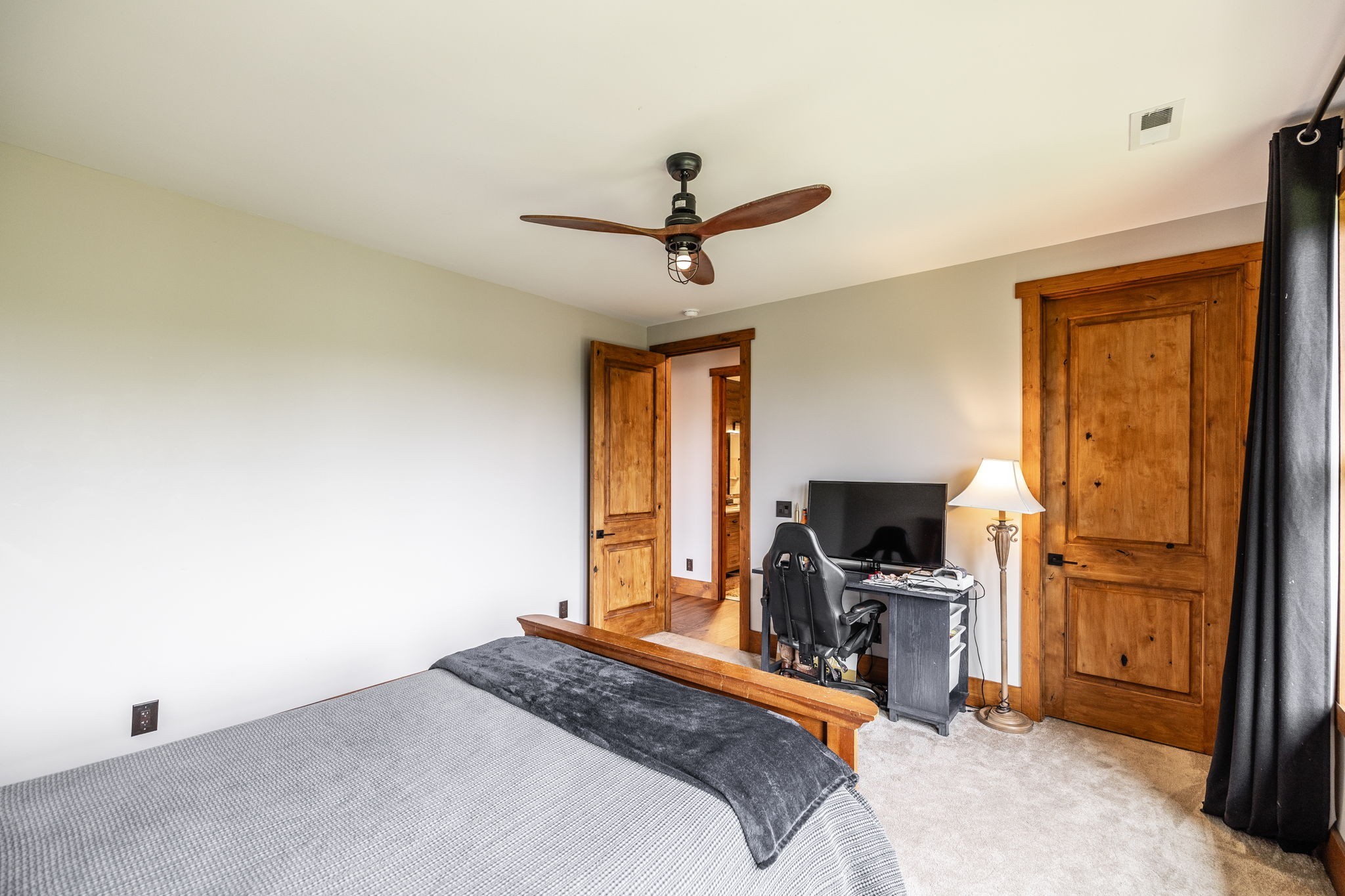 324 Lakeview Road Gallatin, TN 37066 - Photo 64 of 92 a bedroom with a bed and a flat tv screen on the dresser
