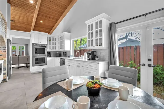 a living room with fireplace furniture and a wooden floor