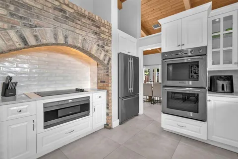a kitchen with a stove and a oven