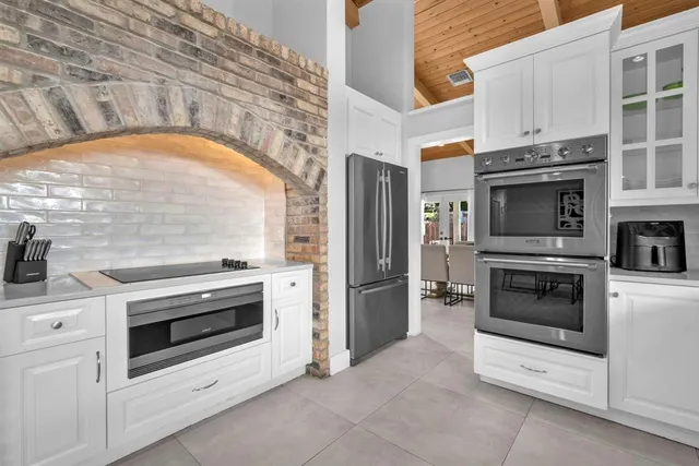 a kitchen with a stove and a oven