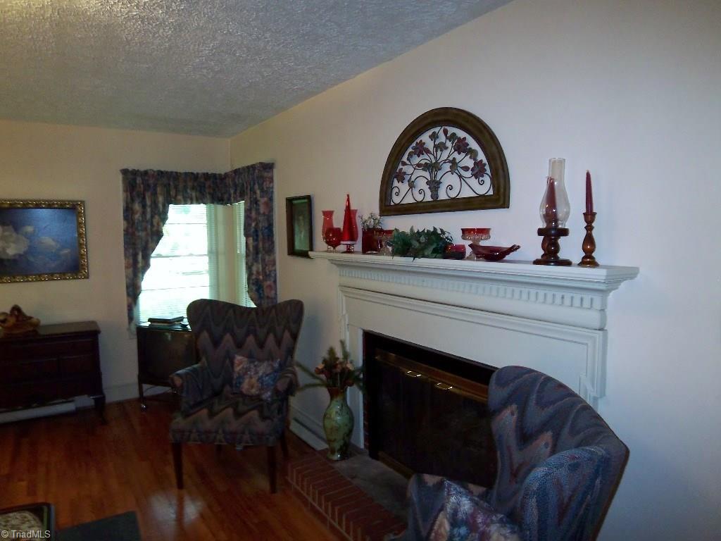 3158 Dillon Road Jamestown, NC 27282 - Photo 6 of 26 Living Room with Fireplace, Gas Logs, and Beautiful Mantel and Trim