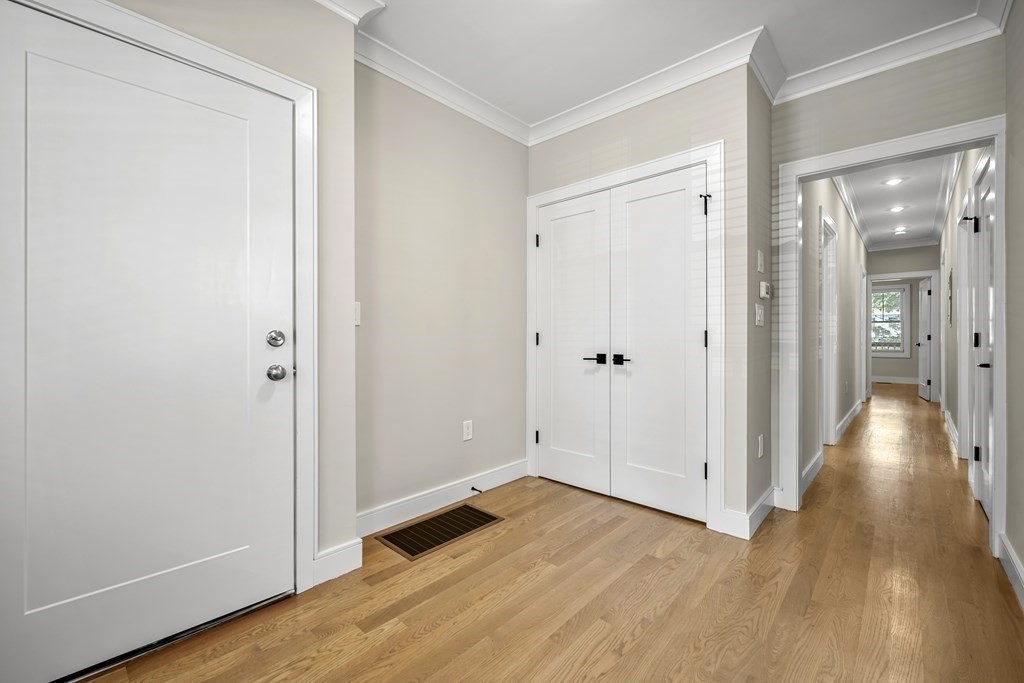 44 Iffley Road Boston, MA 02130 - Photo 16 of 19 a view of empty room with wooden floor