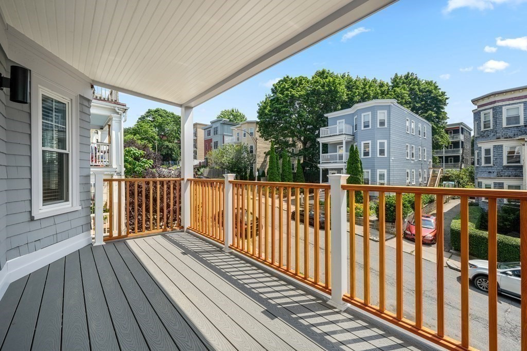 44 Iffley Road Boston, MA 02130 - Photo 4 of 19 a view of balcony with wooden floor and fence