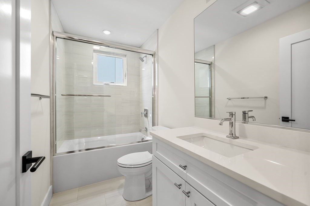 44 Iffley Road Boston, MA 02130 - Photo 6 of 19 a bathroom with a sink a toilet and shower