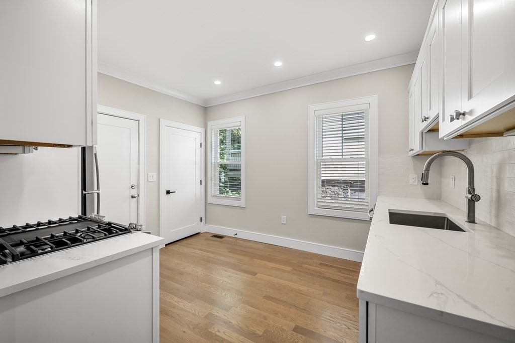 44 Iffley Road Boston, MA 02130 - Photo 10 of 19 a kitchen with a stove and a sink