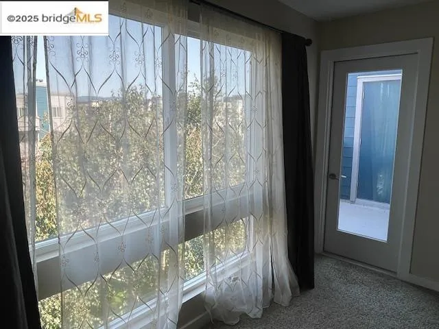 a view of a glass door with a balcony