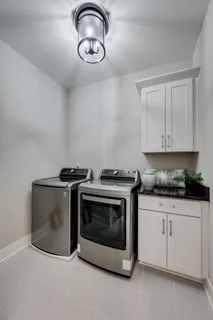 a stove top oven sitting inside of a kitchen