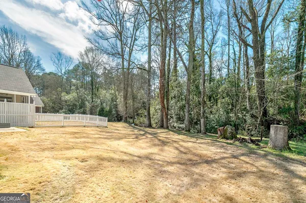 a view of pool and trees in the background