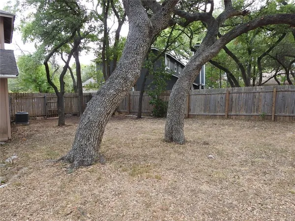 a house with trees in front of it