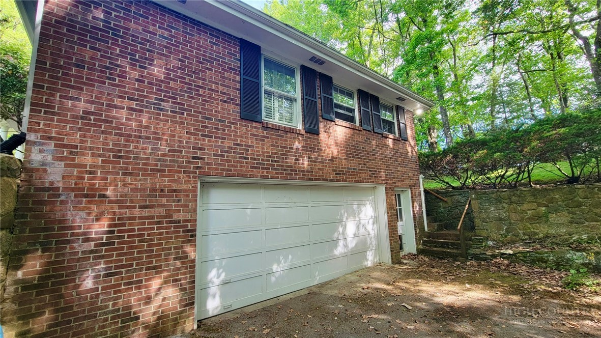 247 Crest Drive Boone, NC 28607 - Photo 16 of 19 a front view of a house with a yard