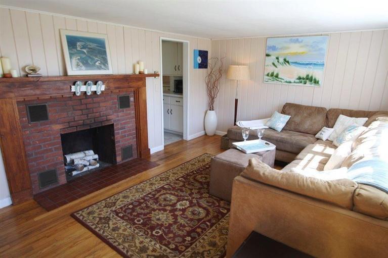 294 Bay View Road South Chatham, MA 02659 - Photo 8 of 34 a living room with furniture and a fireplace