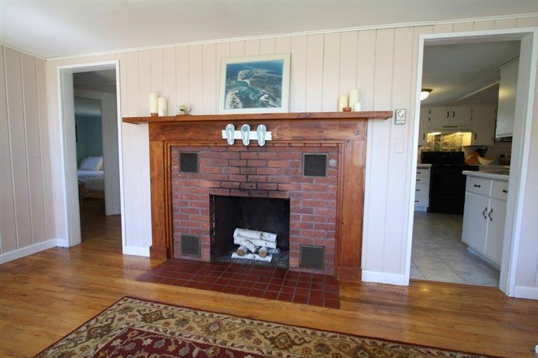 294 Bay View Road South Chatham, MA 02659 - Photo 9 of 34 a living room with a fireplace