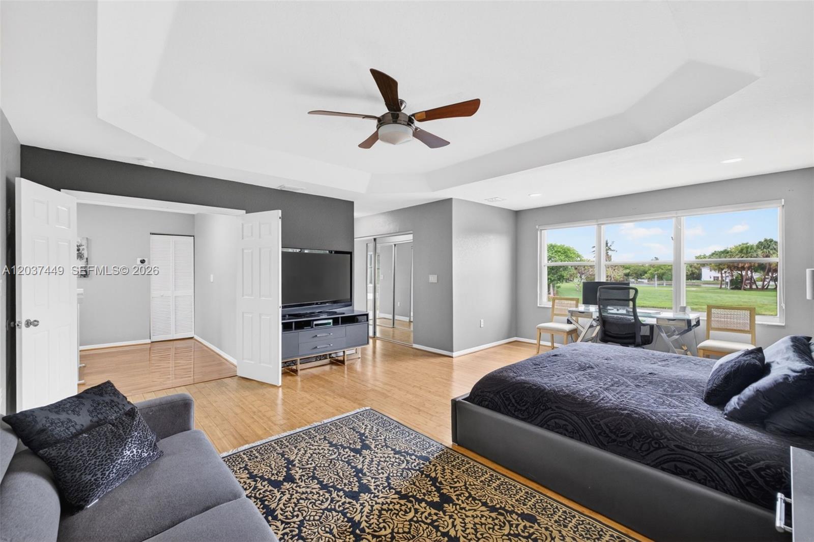 17488 Southwest 28th Court Miramar, FL 33029 - Photo 22 of 50 a living room with furniture large window and a table