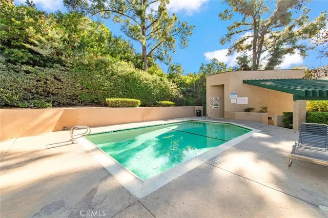 a view of swimming pool with a patio
