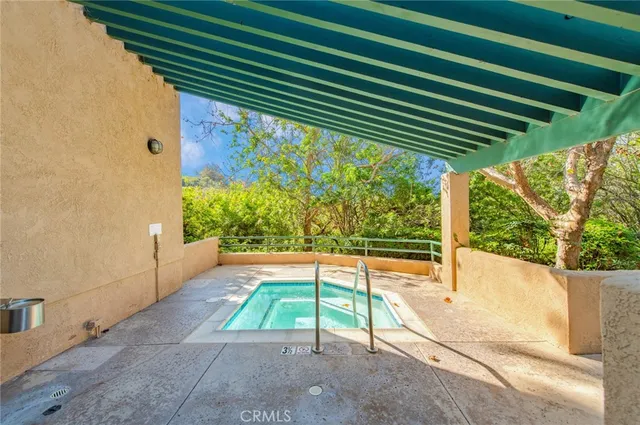 a view of a street with palm trees
