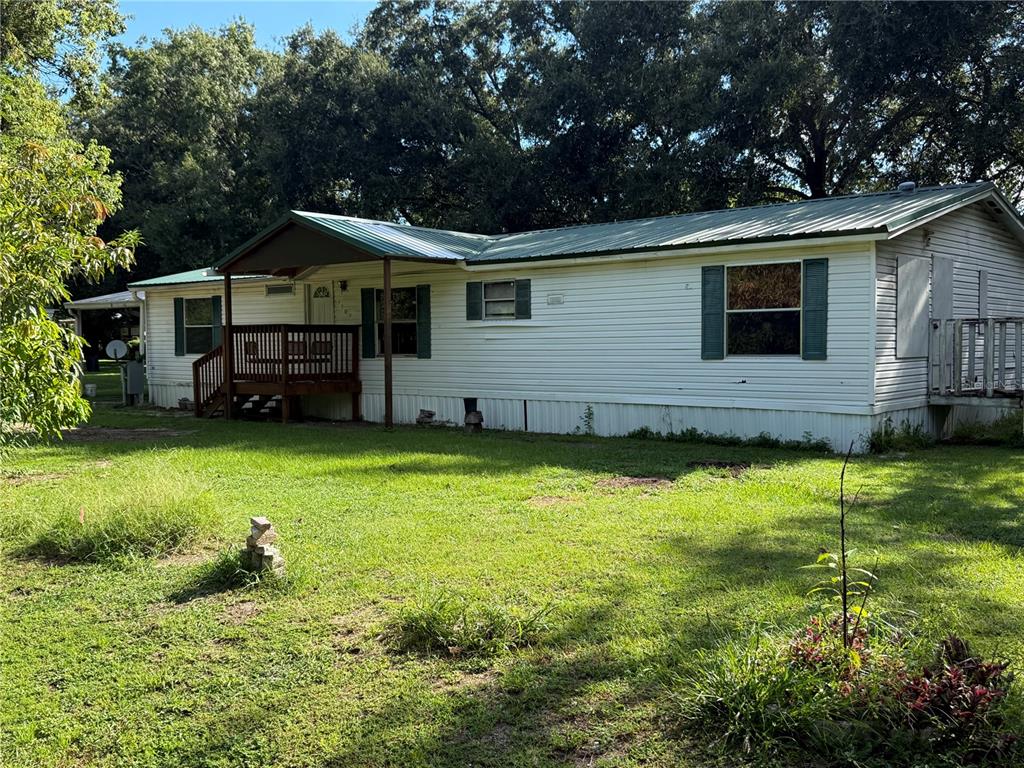 1107 Carmichael Place Dover, FL 33527 - Photo 1 of 17 a house view with a garden space