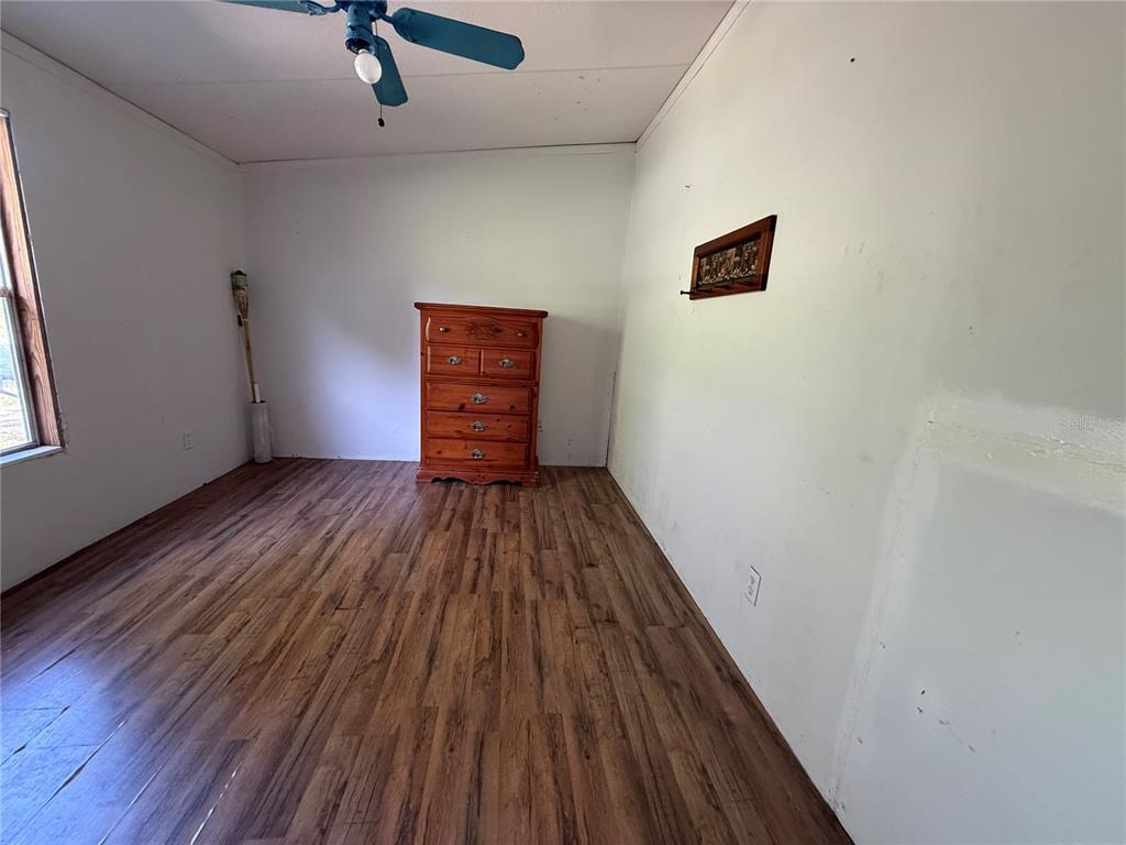 1107 Carmichael Place Dover, FL 33527 - Photo 12 of 17 a view of empty room with wooden floor