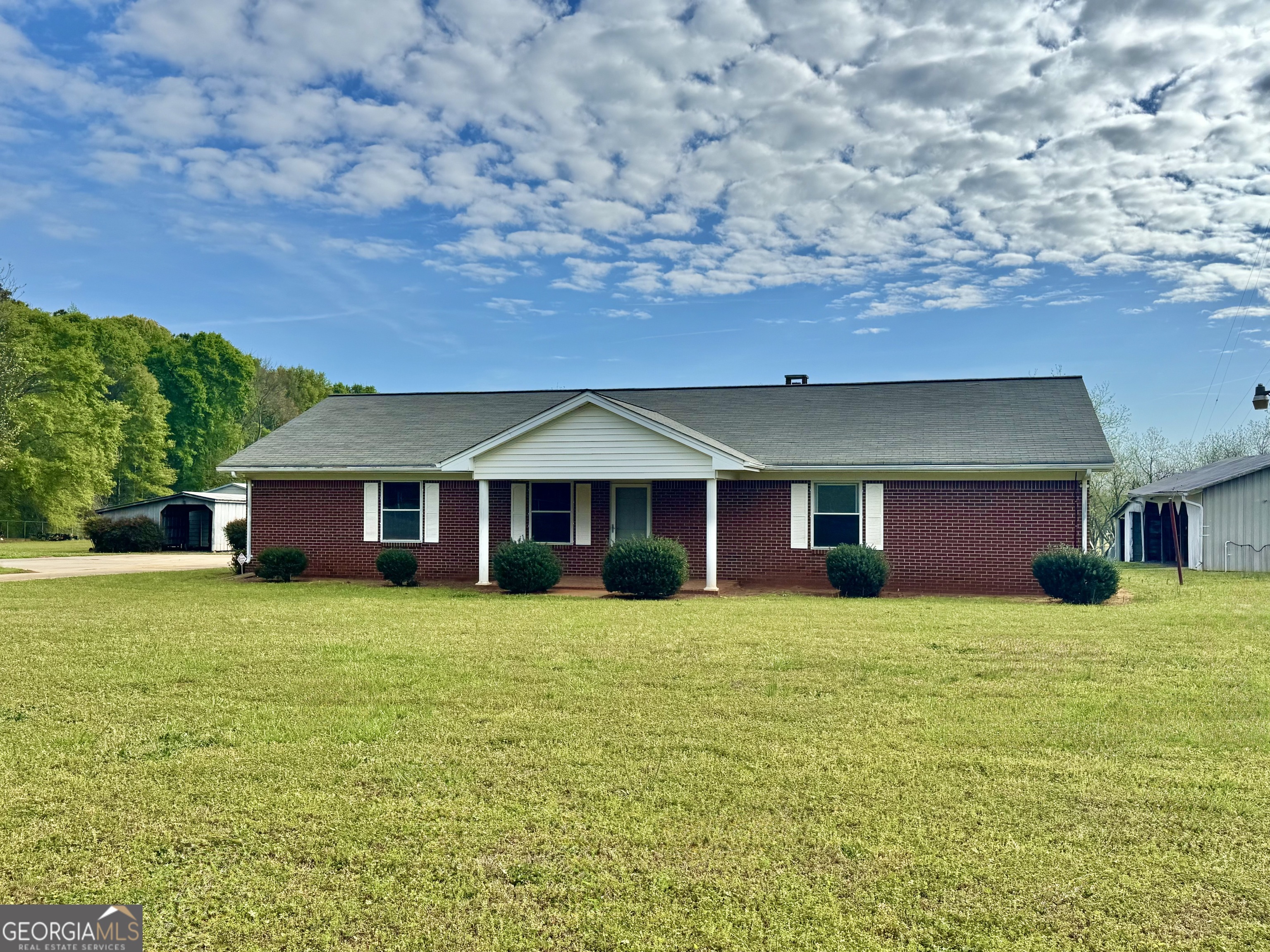 1760 Fears Road Rutledge, GA 30663 - Photo 2 of 68 a front view of a house with a yard