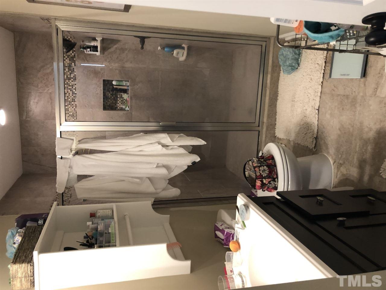 129 Pineland Circle Raleigh, NC 27606 - Photo 14 of 18 a bathroom with a sink and mirror