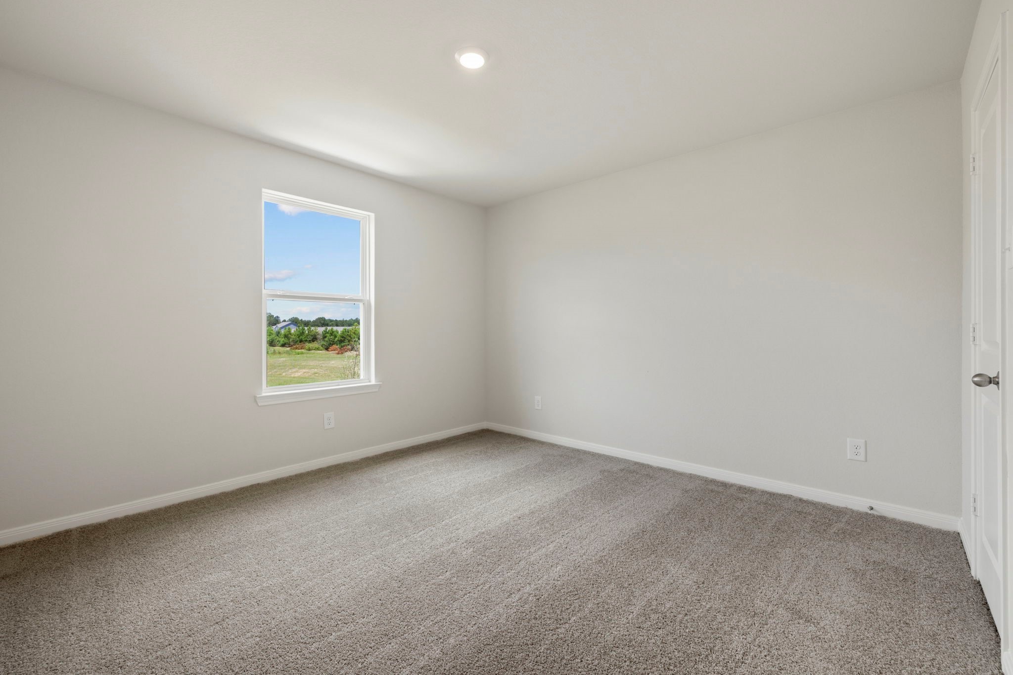 10414 Red Cardinal Drive Cleveland, TX 77328 - Photo 4 of 12 an empty room with windows