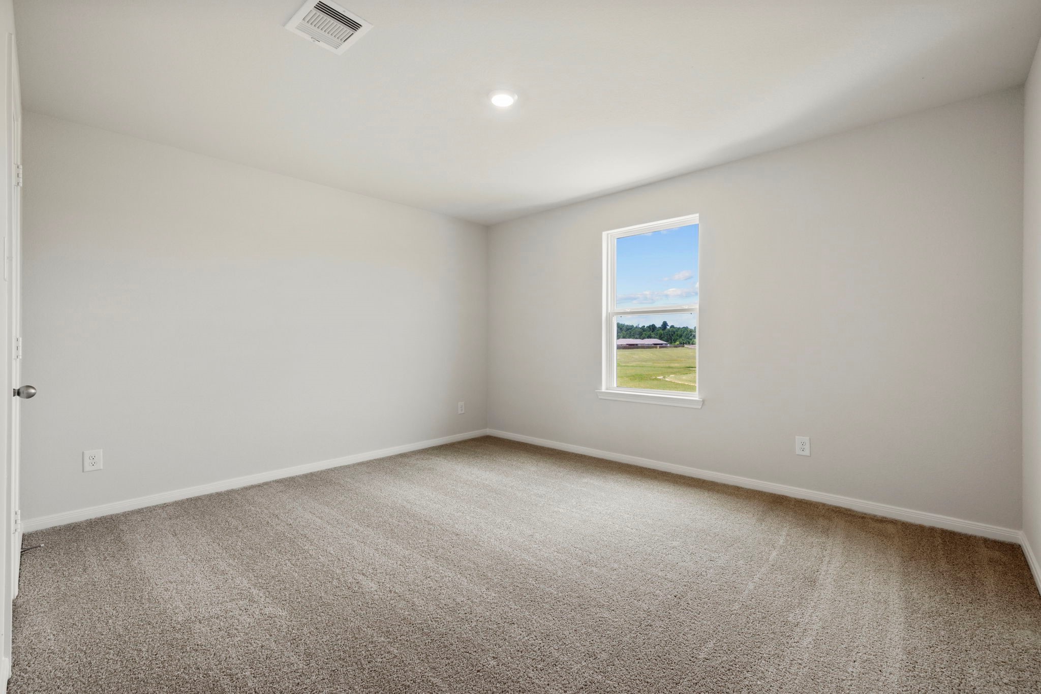 10414 Red Cardinal Drive Cleveland, TX 77328 - Photo 6 of 12 an empty room with a window