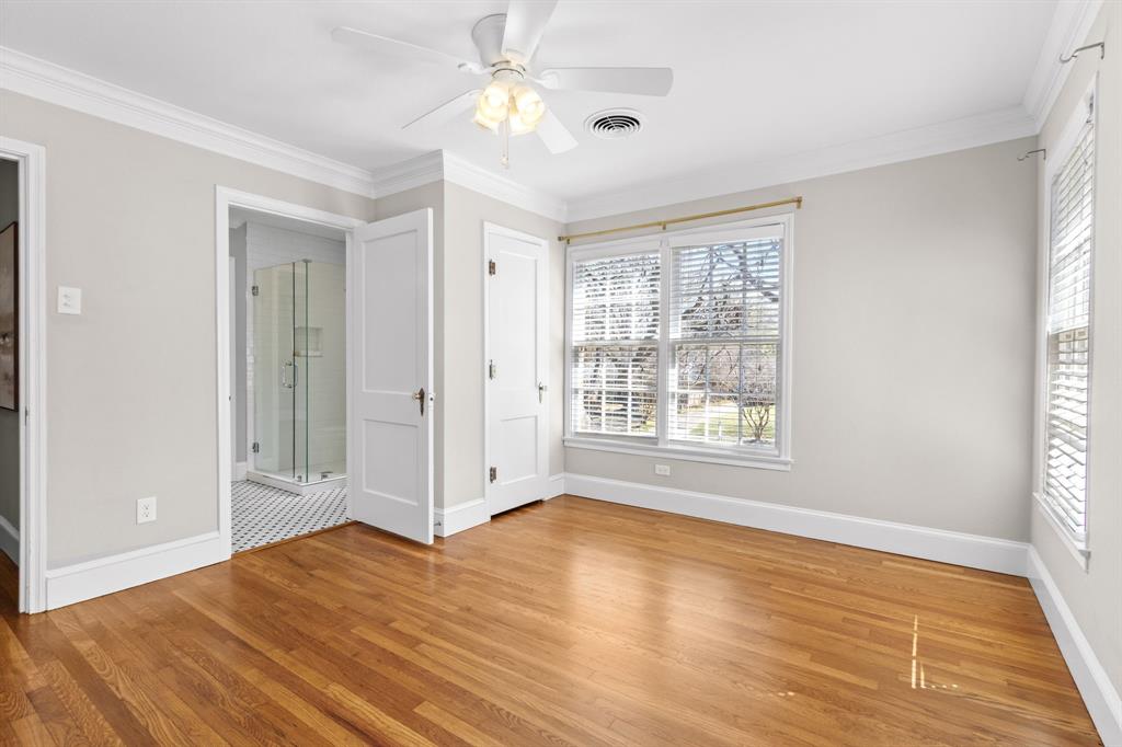 2815 Cumberland Avenue Waco, TX 76708 - Photo 26 of 40 a view of an empty room with a window and wooden floor