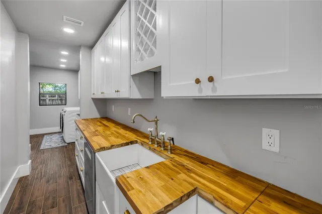 wooden floor in an empty room and a window